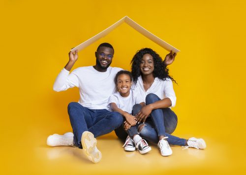 Afro Family Sitting Under Symbolic Roof Thinking About New Home